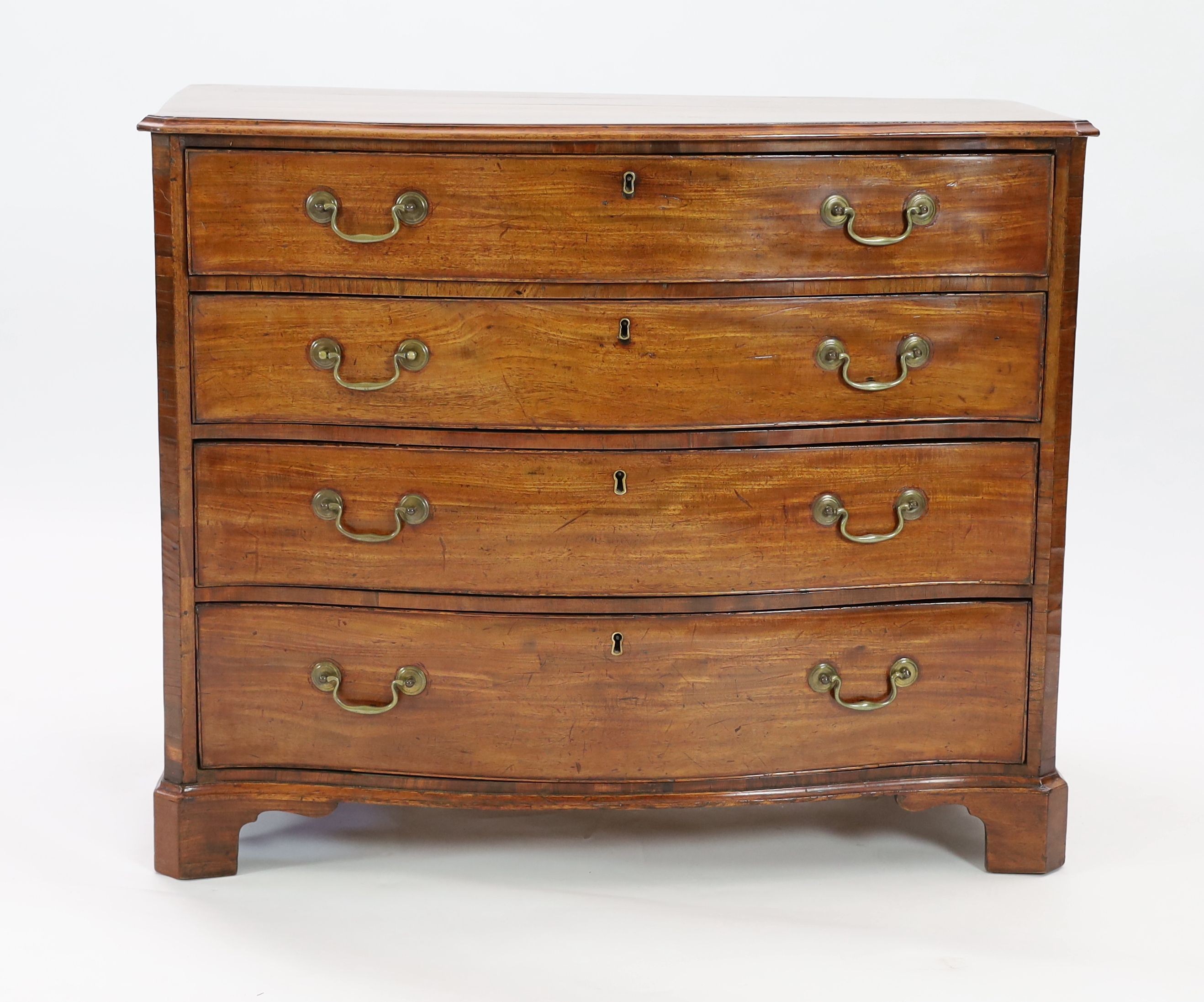 A George III mahogany serpentine dressing chest, W.101cm D.56cm H.84cm